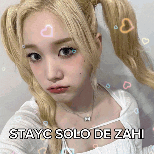 a picture of a girl with pigtails and the words stayc solo de zahi on the bottom