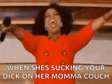 oprah winfrey is holding a microphone with her arms in the air and screaming .