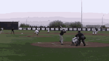a baseball game is being played on a field with a banner that says ' arizona '