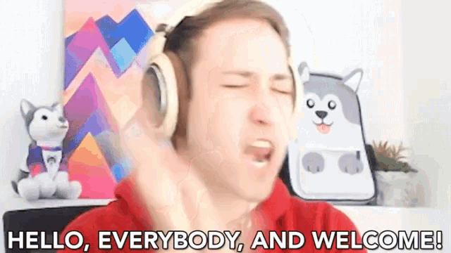 a man wearing headphones says hello everybody and welcome !