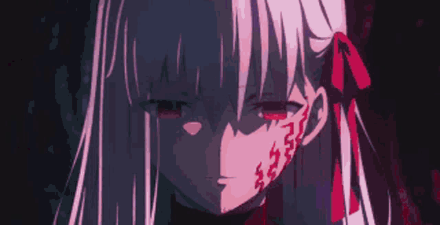 a close up of a girl with purple hair and red eyes .