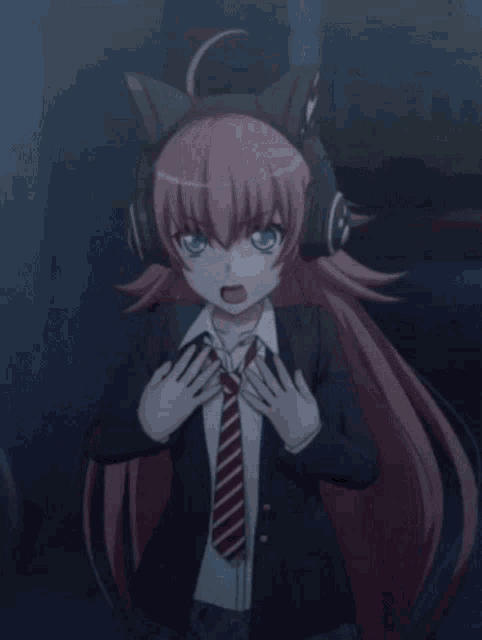 a girl in a suit and tie is wearing a cat headband .