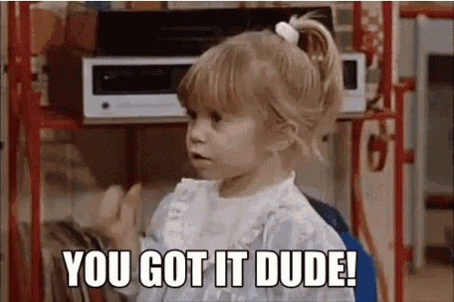 a little girl is saying `` you got it dude '' while standing next to a microwave .