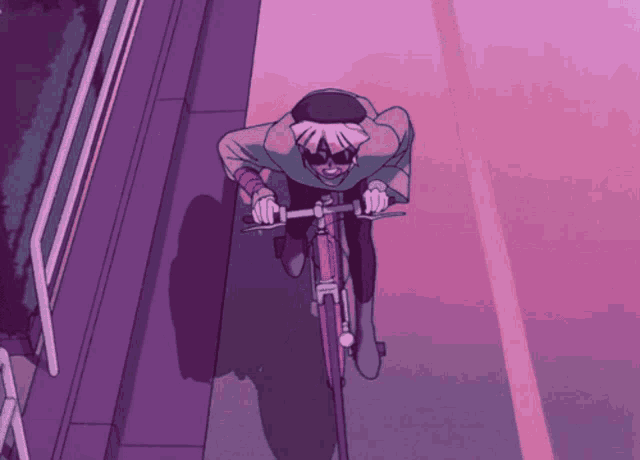 a person is riding a pink bike on a purple street
