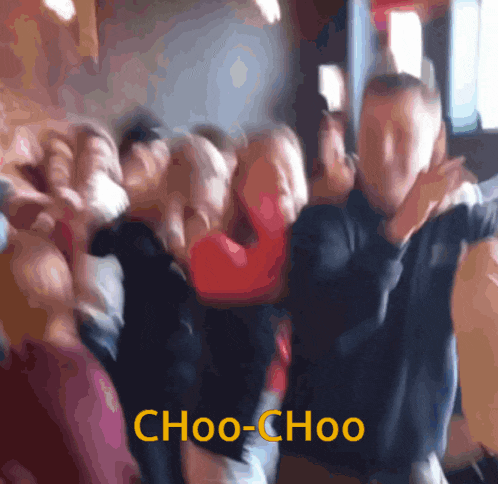 a blurry photo of people dancing with the words choo-choo written in yellow