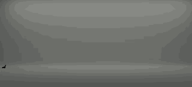 a gray background with a few spots of light on it