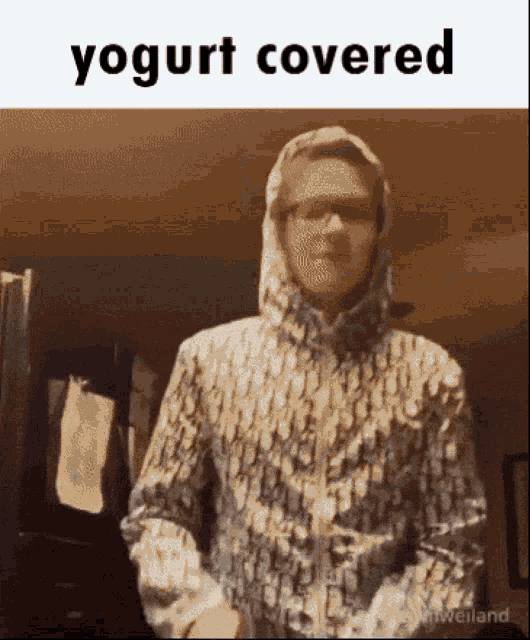 a man in a hooded jacket with the word yogurt covered on the bottom