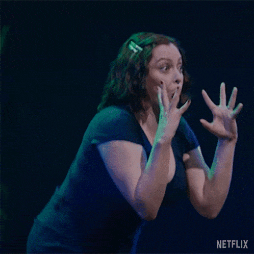 a woman in a black shirt is making a funny face with netflix written in the corner