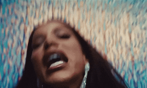 a close up of a woman 's face with a blurry background