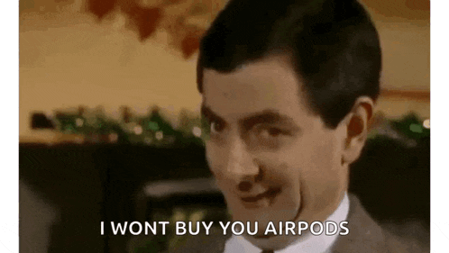 mr bean is wearing a suit and tie and saying `` i wont buy you airpods '' .
