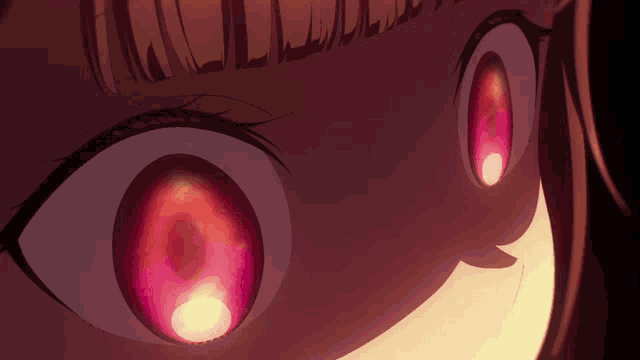 a close up of a girl 's eyes with red glowing circles