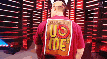 a man wearing a red shirt that says uc time