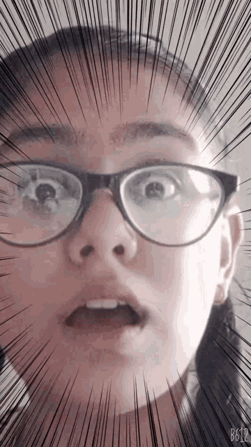a woman wearing glasses has a surprised expression on her face