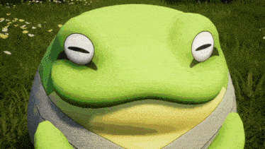 a green and yellow frog is sitting in the grass