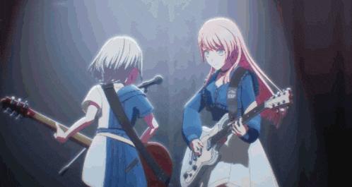 two anime girls playing guitars and singing into microphones on a stage .