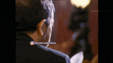 a close up of a man 's face with the username / kurtlarvadisikaos