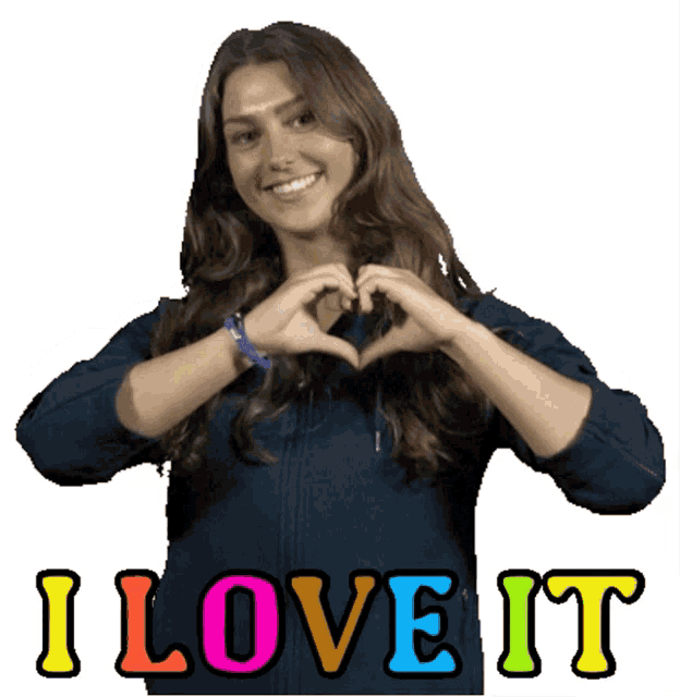 a woman is making a heart shape with her hands and the words i love it behind her