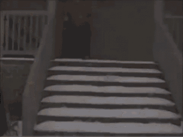 a person is falling down a set of stairs covered in snow .