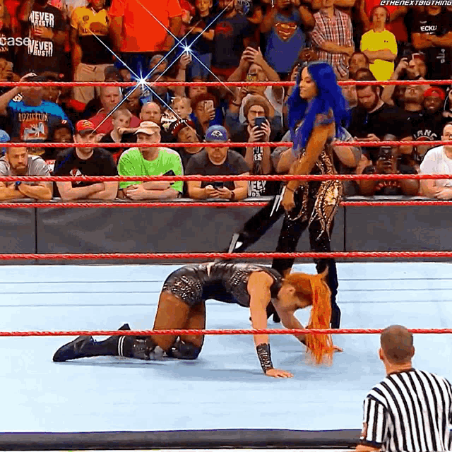 two women in a wrestling ring with a crowd watching and a sign that says case never