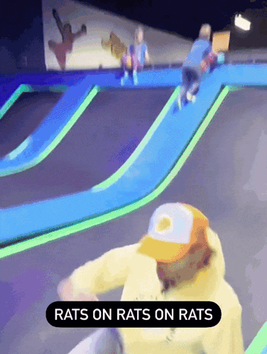 a person riding a trampoline with the words rats on rats on rats