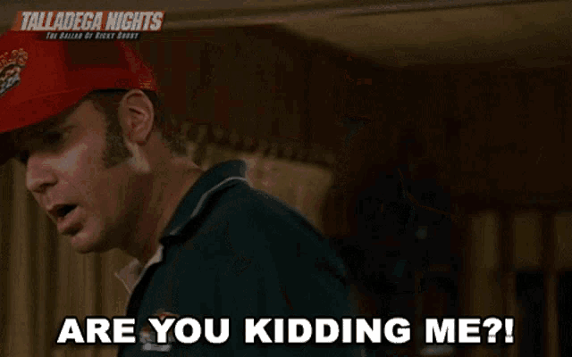 a man wearing a red hat that says " are you kidding me "