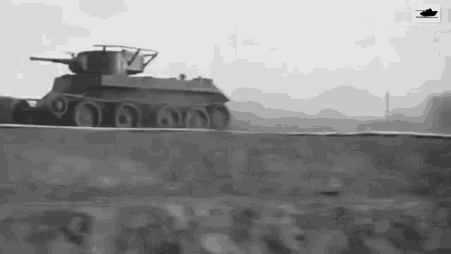 a black and white photo of a military tank driving down a road .
