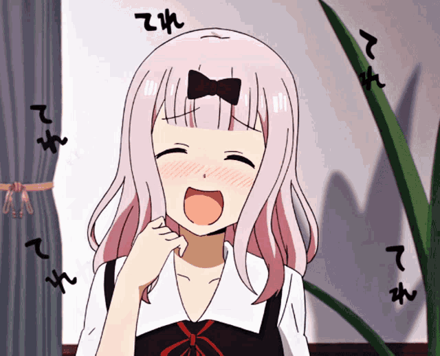 a girl with pink hair and a bow on her head is laughing