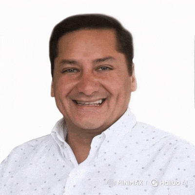 a man wearing a white shirt with polka dots is smiling for the camera