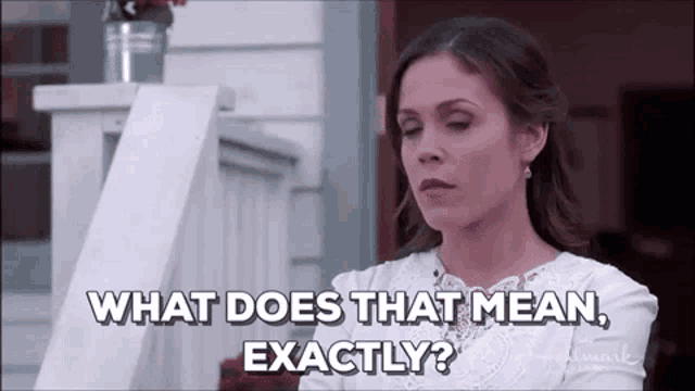 a woman in a white dress is asking what does that mean , exactly .