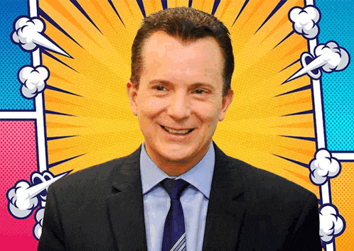 a man in a suit and tie smiles in front of a colorful background