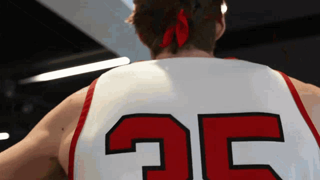 a man wearing a basketball jersey with the number 35 on the back