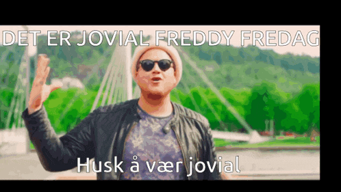 a man wearing sunglasses and a hat is standing in front of a bridge with the words det er jovial freddy fredag .