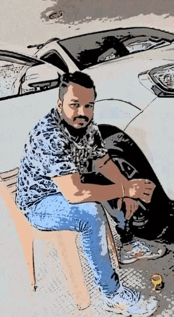 a man is sitting on a chair in front of a white car