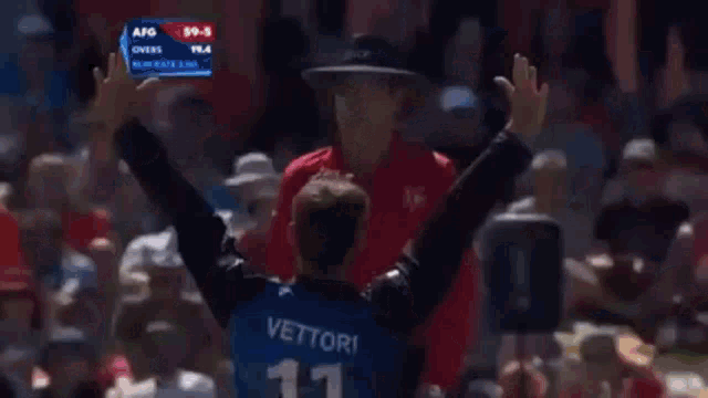 a cricket player is wearing a helmet and holding a bat ..