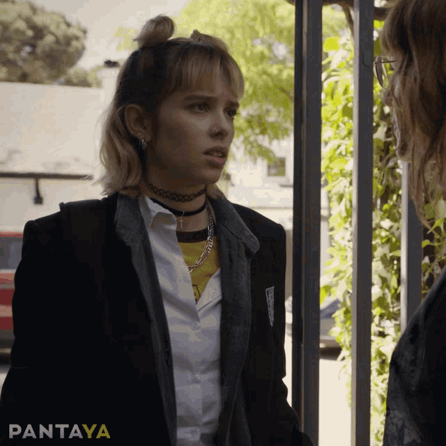 a woman standing next to another woman with the word pantaya on the bottom right