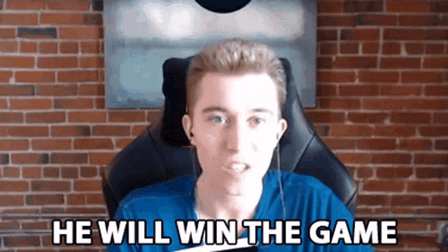 a man is sitting in a chair with the words he will win the game behind him