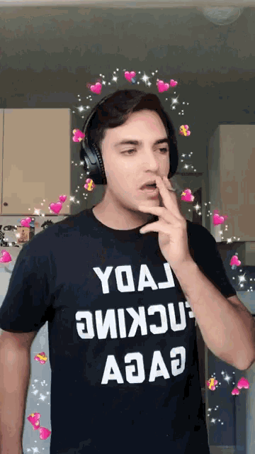 a man wearing headphones and a black shirt that says yoaj