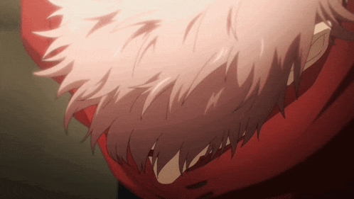 a close up of a person 's hair with a red scarf
