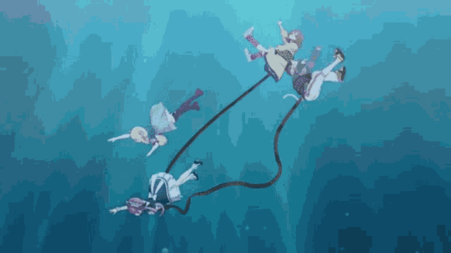 three anime characters are floating in the water with a rope .