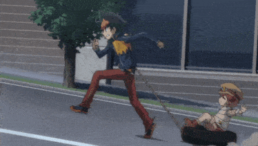 a boy is pulling a girl in a tire on the street