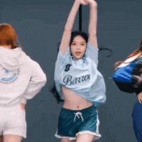 a woman in a blue shirt that says barro is dancing