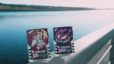 a person is holding two cards one of which says angel cab