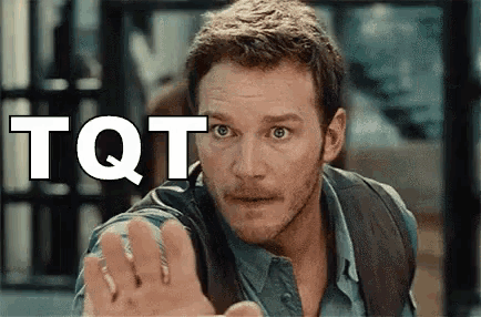 a man is making a stop sign with his hand in front of the word tot .