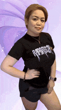 a woman wearing a black t-shirt that says rap rock