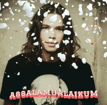 a man with long hair is surrounded by snowflakes and the words assalamualaikum