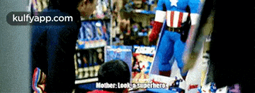a man in a captain america costume is talking to a child in a toy store .