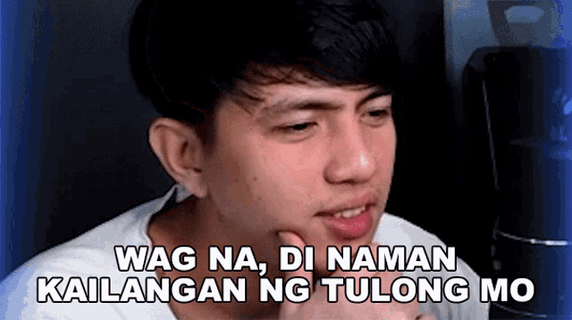 a young man is making a funny face with the words wag na di naman kailangan ng tulong mo