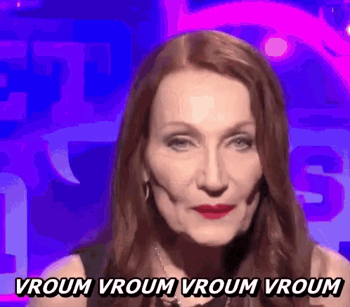 a woman with red hair is saying vroom vroom vroom vroom in a foreign language .