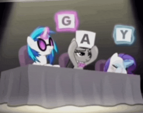 a group of ponies sitting at a table holding signs that say gay