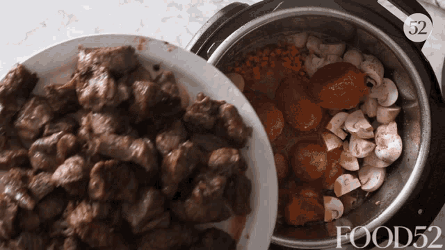 a plate of meat sits next to a pot of vegetables with food52 written on the bottom